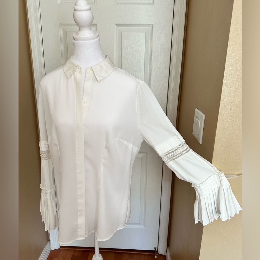 Chico’s white blouse with pleads and lace on sleeves size 1  (M)